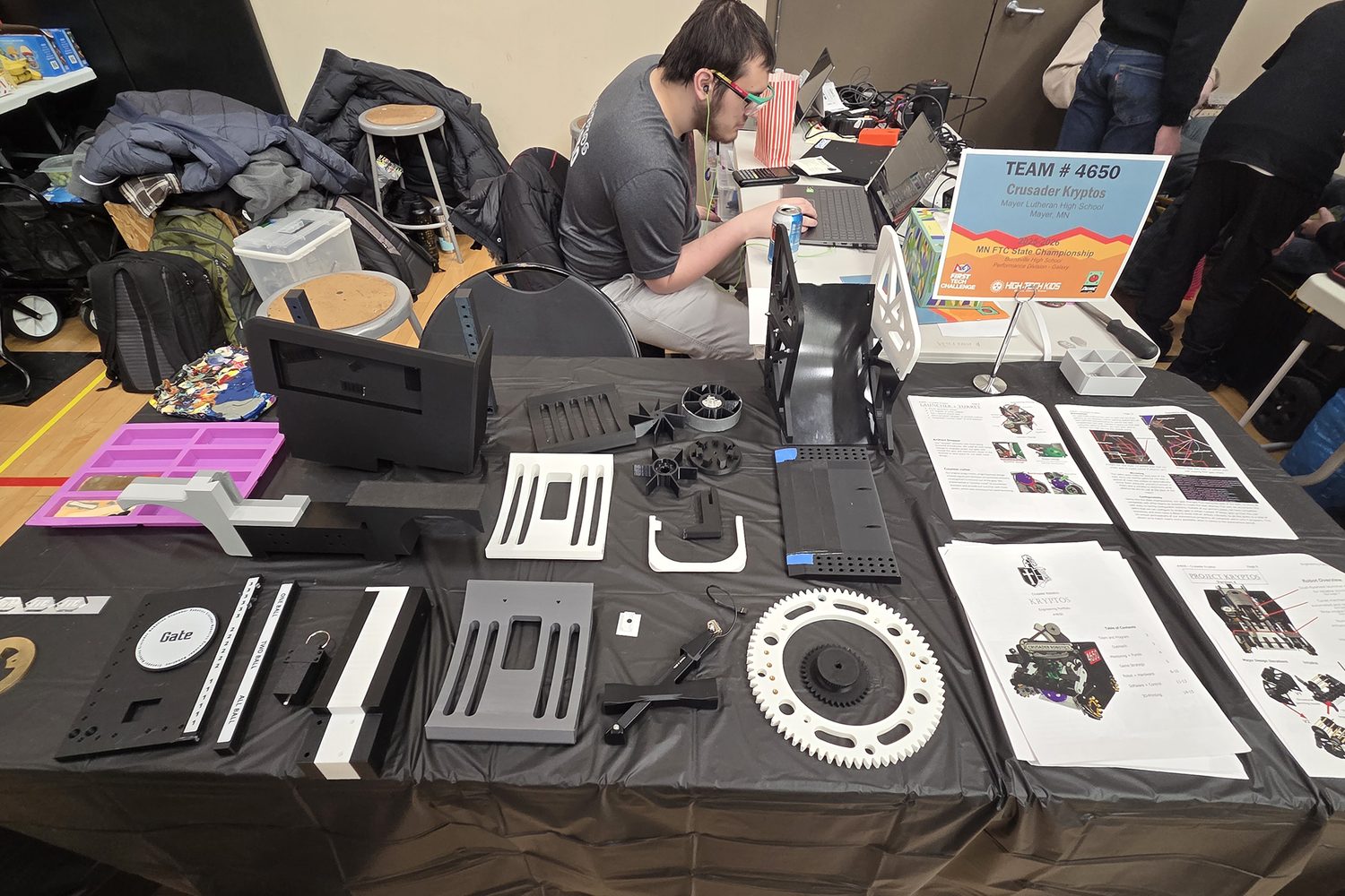 Pit table covered with 3D-printed parts and a laptop