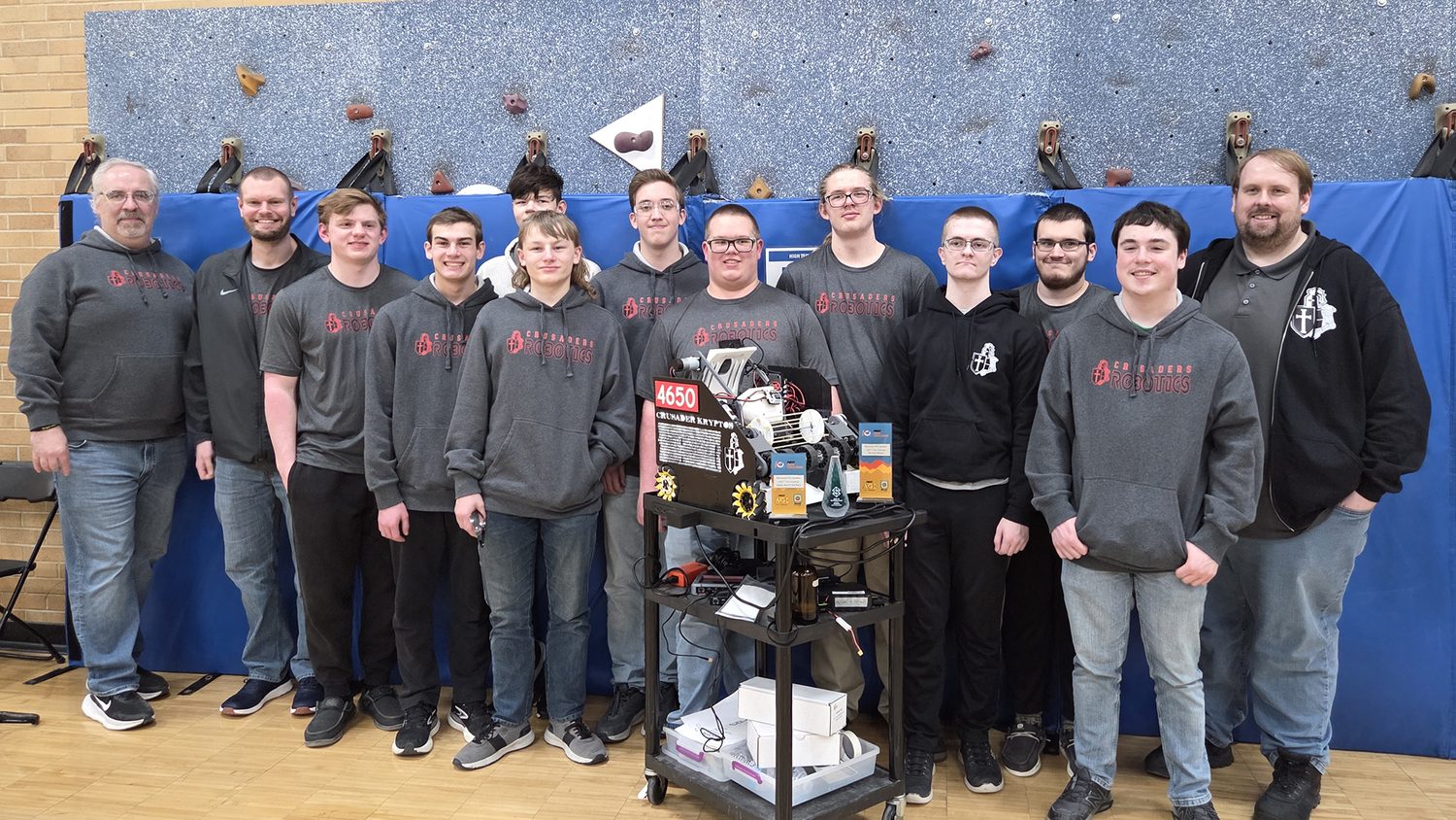 The whole Crusader Robotics team and coaches with their robot